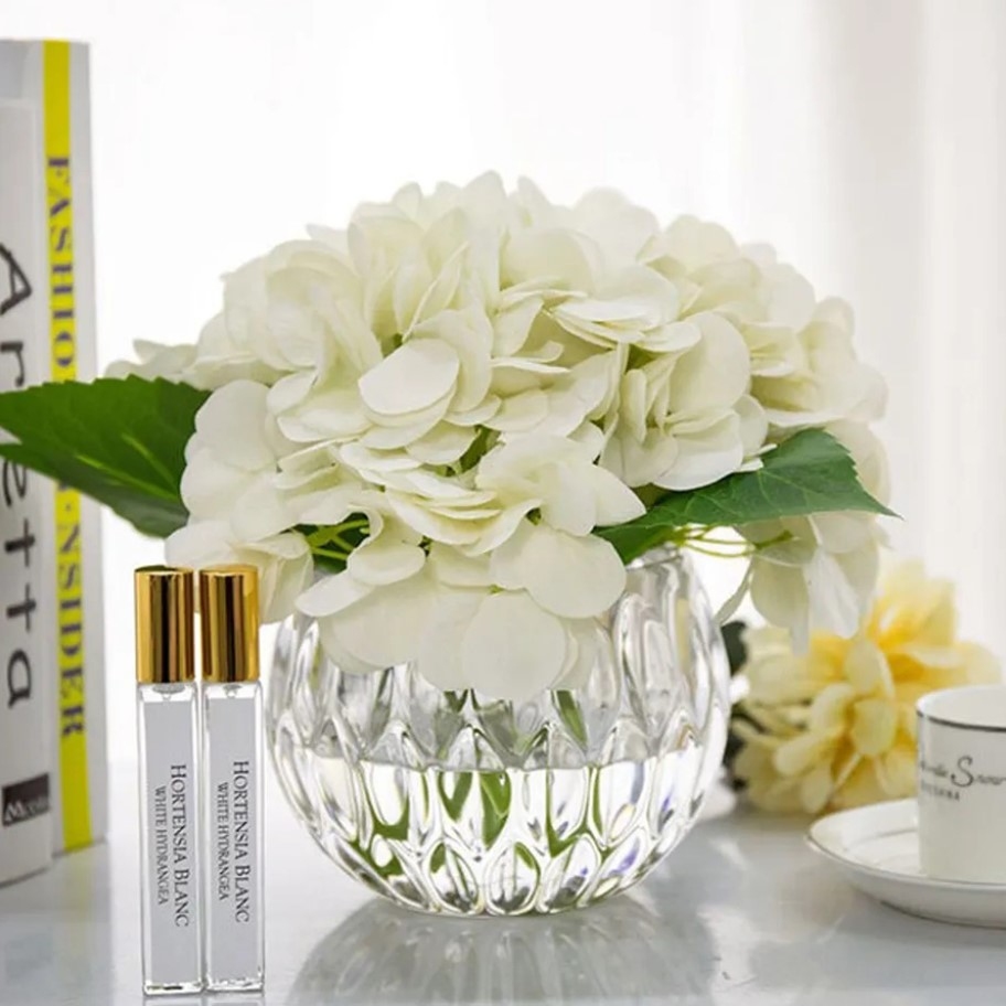 Perfumed bouquet of hydrangeas in transparent vase