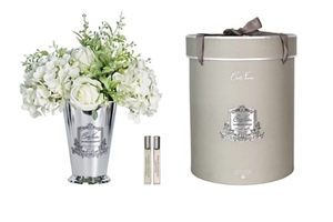 Perfumed bouquet of summer flowers in silver vase