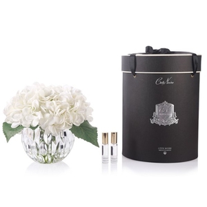 Perfumed bouquet of hydrangeas in transparent vase