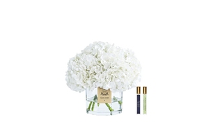 Parfumed bouquet of hydrangeas in transparent vase